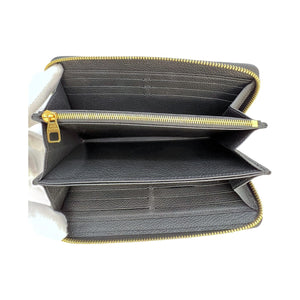 Louis Vuitton Monogram Empreinte Leather Zippy Wallet