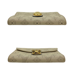 Sold at Auction: Louis Vuitton, Louis Vuitton Old Rose Amelia Wallet, the  calf leather monogram mahina with silver brass accent push lock buckle,  opening to two car
